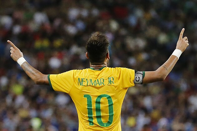 FILE - In this Oct. 14, 2014, file photo, Brazil's Neymar celebrates after scoring the forth goal during an international friendly soccer match in Singapore. (AP Photo/Wong Maye-E,File)