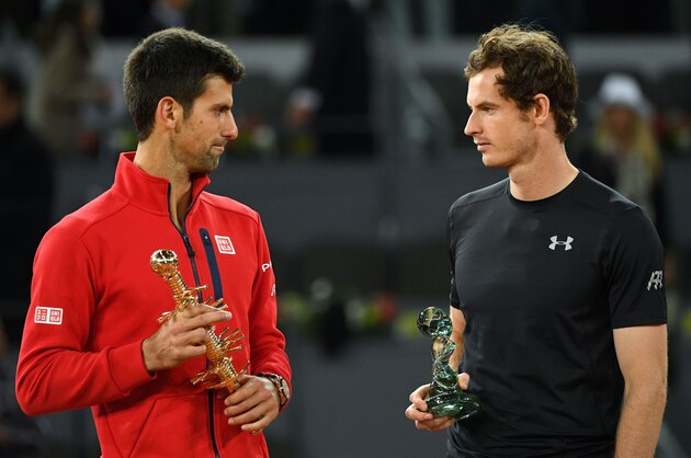 Serbia's Novak Djokovic (L) and Britain's Andy Murray pose with their trophies after the Madrid Open men's tennis final at the Caja Magica (Magic Box) sports complex in Madrid on May 8, 2016. / AFP / GERARD JULIEN        (Photo credit should read GERARD JULIEN/AFP/Getty Images)