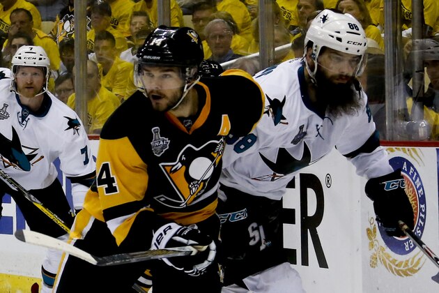 Pittsburgh Penguins' Chris Kunitz (14) plays against San Jose Sharks' Brent Burns (88) during the third period in Game 2 of the NHL hockey Stanley Cup Finals on Wednesday, June 1, 2016, in Pittsburgh. (AP Photo/Keith Srakocic)