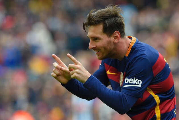 Barcelona's Argentinian forward Lionel Messi celebrates after scoring a goal during the Spanish league football match FC Barcelona vs RCD Espanyol at the Camp Nou stadium in Barcelona on May 8, 2016. / AFP / LLUIS GENE        (Photo credit should read LLUIS GENE/AFP/Getty Images)