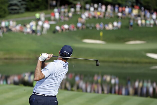 Matt Kuchar watches his tee shot on the 12th hole during the second round of the Memorial golf tournament, Friday, June 3, 2016, in Dublin, Ohio. (AP Photo/Darron Cummings)