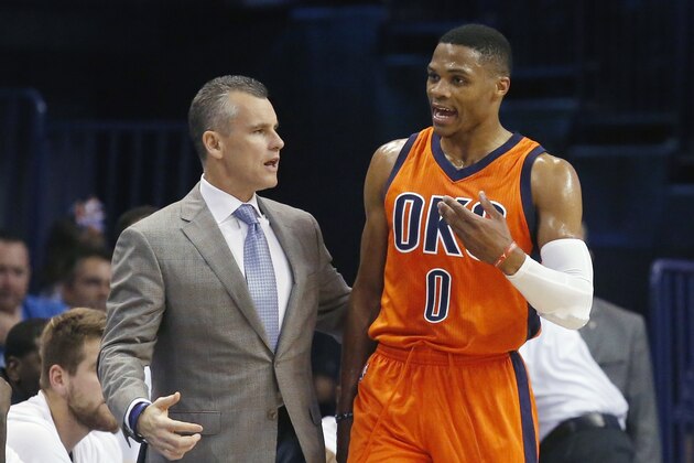 Oklahoma City Thunder head coach Billy Donovan, left, talks with Russell Westbrook in the second half of an NBA basketball game against the Denver Nuggets in Oklahoma City, Sunday, Nov. 1, 2015. Oklahoma City won 117-93. (AP Photo/Sue Ogrocki)