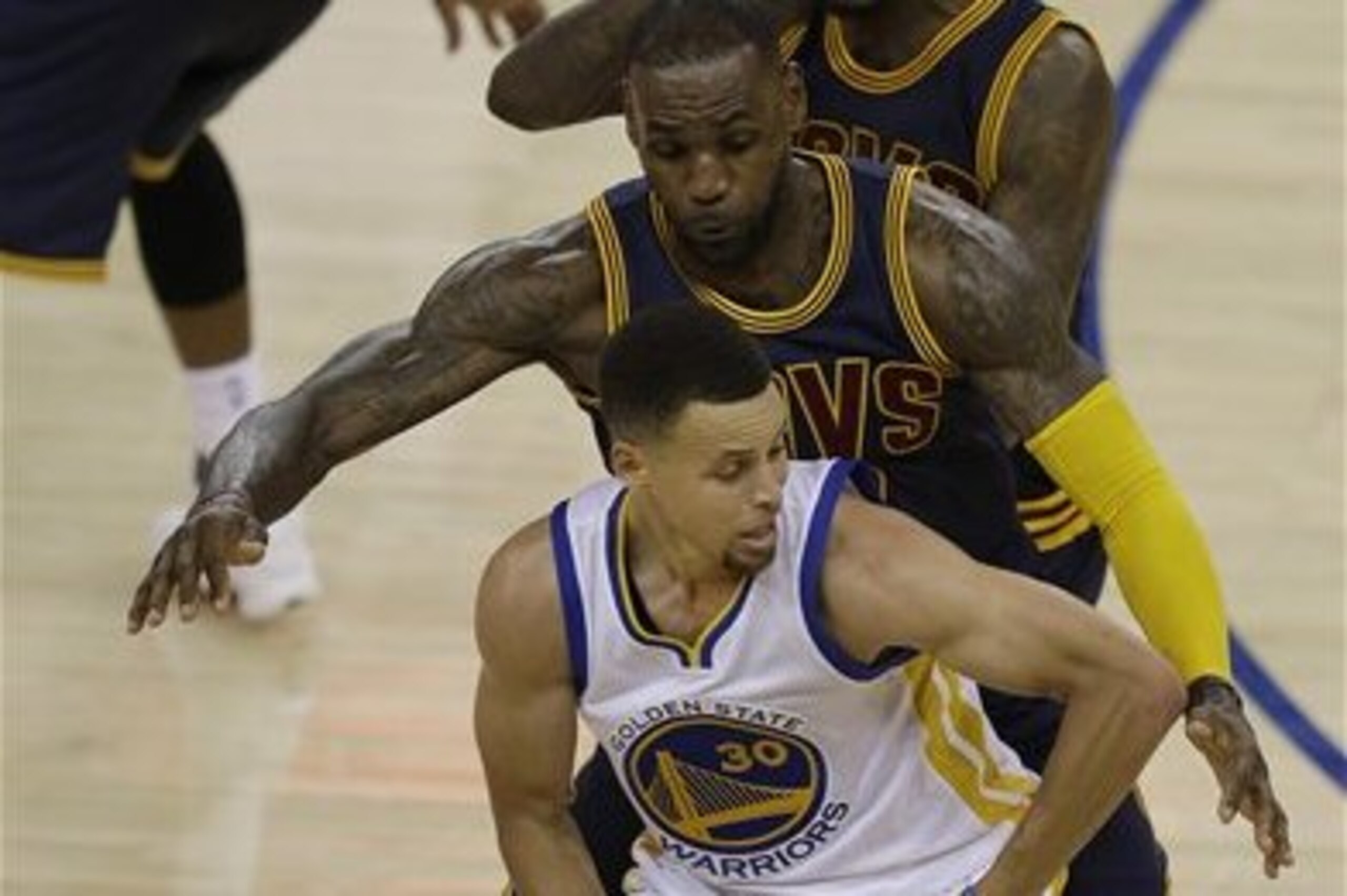 Golden State Warriors guard Stephen Curry (30) is guarded by Cleveland Cavaliers forward LeBron James, center, and guard Iman Shumpert during the second half of Game 1 of basketball's NBA Finals in Oakland, Calif., Thursday, June 2, 2016. (AP Photo/Ben Margot) Golden State Warriors guard Stephen Curry (30) is guarded by Cleveland Cavaliers forward LeBron James, center, and guard Iman Shumpert during the second half of Game 1 of basketball's NBA Finals in Oakland, Calif., Thursday, June 2, 2016. (AP Photo/Ben Margot)