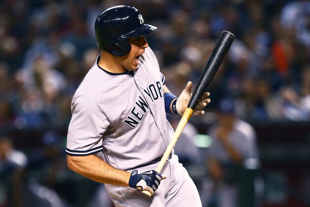 May 18, 2016; Phoenix, AZ, USA; New York Yankees first baseman Mark Teixeira reacts to an inside pitch against the Arizona Diamondbacks at Chase Field. Mandatory Credit: Mark J. Rebilas-USA TODAY Sports