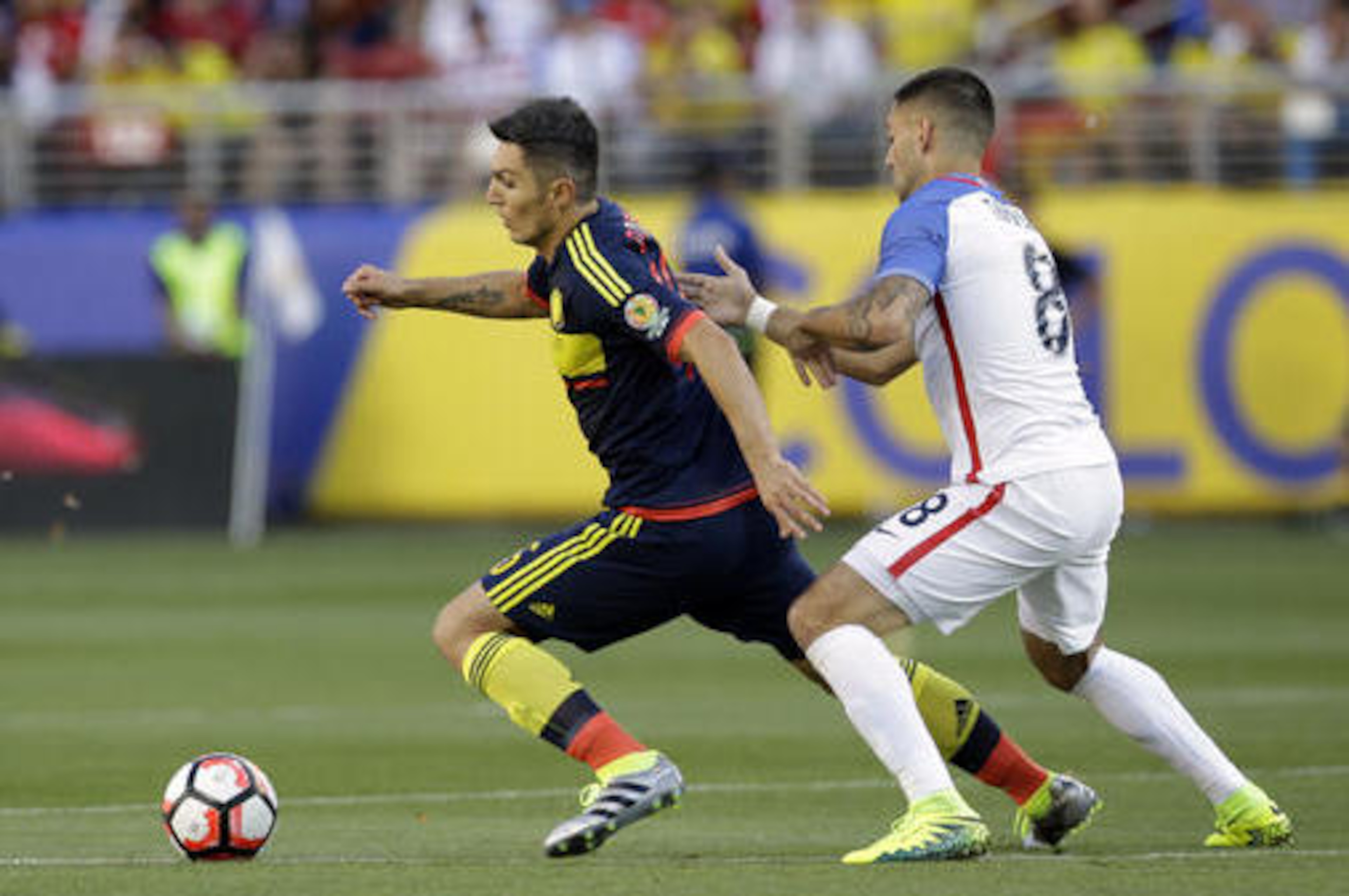 Colombia's Daniel Torrez and Clint Dempsey of the United States, fight for the ball during a Copa America Centenario Group A soccer match at Levi's Stadium in Santa Clara, Calif., Friday, June 3, 2016. (AP Photo/Marcio Jose Sanchez)