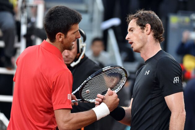 Serbia's Novak Djokovic (L) shakes hands after beating Britain's Andy Murray during the Madrid Open men's tennis final at the Caja Magica (Magic Box) sports complex in Madrid on May 8, 2016. / AFP / GERARD JULIEN        (Photo credit should read GERARD JULIEN/AFP/Getty Images)