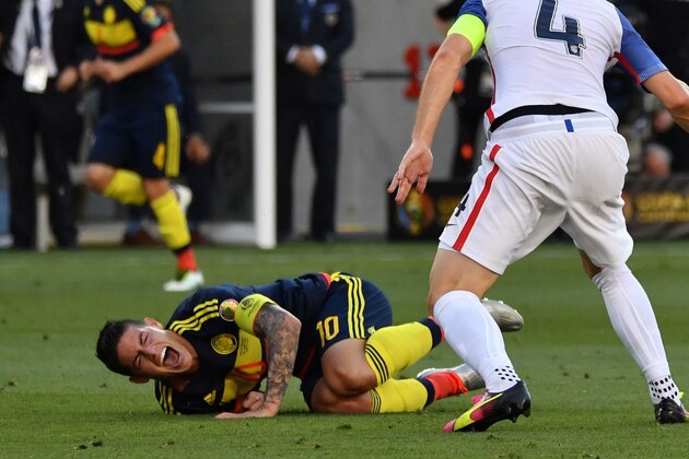 Colombia's James Rodriguez (L) gestures in pain next to USA's Michael Bradley during the Copa America Centenario football tournament match in Santa Clara, California, United States, on June 3, 2016. / AFP / JOSH EDELSON        (Photo credit should read JOSH EDELSON/AFP/Getty Images)