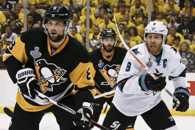 San Jose Sharks' Joe Pavelski (8), right,  plays against Pittsburgh Penguins' Brian Dumoulin (8) during the second period in Game 2 of the NHL hockey Stanley Cup Finals on Wednesday, June 1, 2016, in Pittsburgh. (AP Photo/Keith Srakocic)