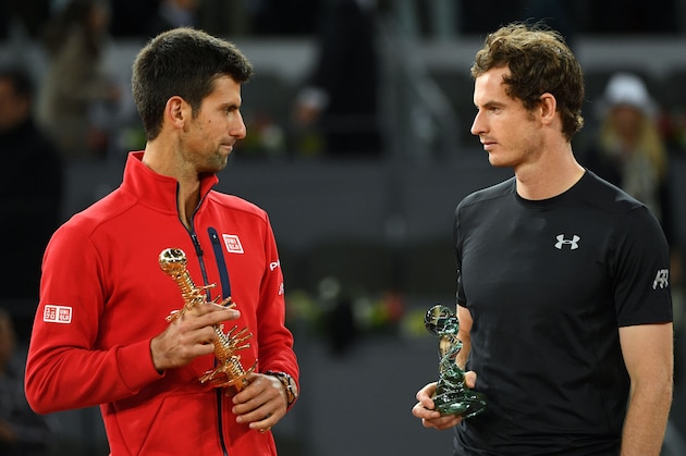 Serbia's Novak Djokovic (L) and Britain's Andy Murray pose with their trophies after the Madrid Open men's tennis final at the Caja Magica (Magic Box) sports complex in Madrid on May 8, 2016. / AFP / GERARD JULIEN        (Photo credit should read GERARD JULIEN/AFP/Getty Images)