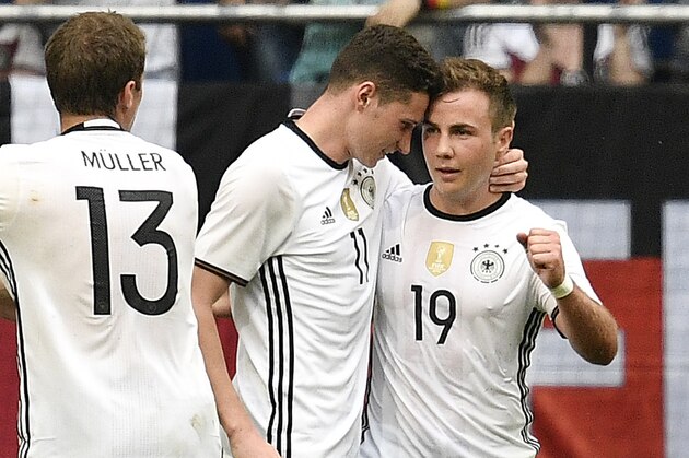 Germany’s Mario Goetze , right, is celebrated by Germany’s Julian Draxler after scoring during the international friendly soccer match between Germany and Hungary in Gelsenkirchen, Germany, Saturday, June 4, 2016. (AP Photo/Martin Meissner)