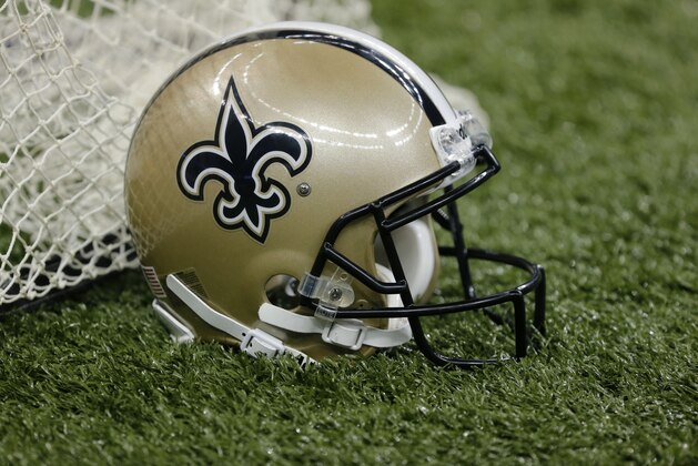 A New Orleans Saints helmet sits on the sideline in the second half of an NFL football game against the Atlanta Falcons in New Orleans, Sunday, Sept. 8, 2013. (AP Photo/Bill Haber)