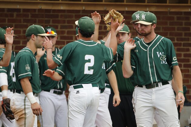 William & Mary pitcher Nick Brown (2) is welcomed back to the dugout after the fourth inning of an NCAA college regional baseball game agains Bryant in Charlottesville, Va., Saturday, June 4, 2016. (AP Photo/Steve Helber)