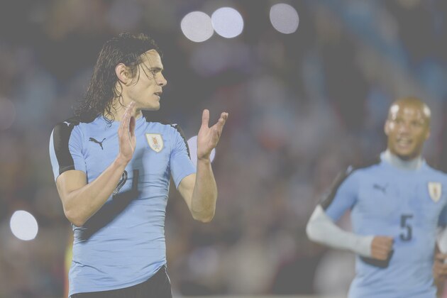 Uruguay's player Edinson Cavani celebrates a goal with teammate Diego Sanchez during a friendly football match Uruguay vs Trinidad and Tobago at the Centenario stadium in Montevideo on May 27, 2016. / AFP / MIGUEL ROJO        (Photo credit should read MIGUEL ROJO/AFP/Getty Images)