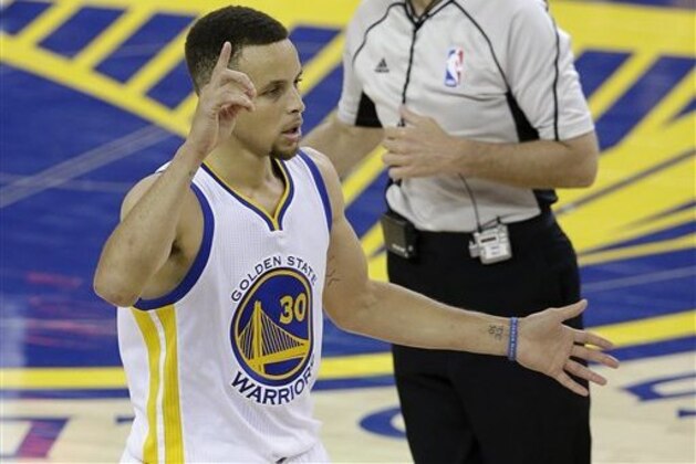 Golden State Warriors guard Stephen Curry (30) gestures after the Warriors scored against the Cleveland Cavaliers during the second half of Game 1 of basketball's NBA Finals in Oakland, Calif., Thursday, June 2, 2016. The Warriors won 104-89 (AP Photo/Marcio Jose Sanchez)