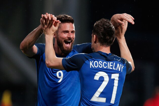 France's Laurent Koscielny celebrates with teammate France's Olivier Giroud, left, after he scored a goal during the friendly soccer match between France and Scotland at the Saint Symphorien Stadium in Metz, eastern France, Saturday, June 4, 2016. The French squad is in preparation for the EURO 2016 soccer championships which will start on June 10, 2016. (AP Photo/Thibault Camus)