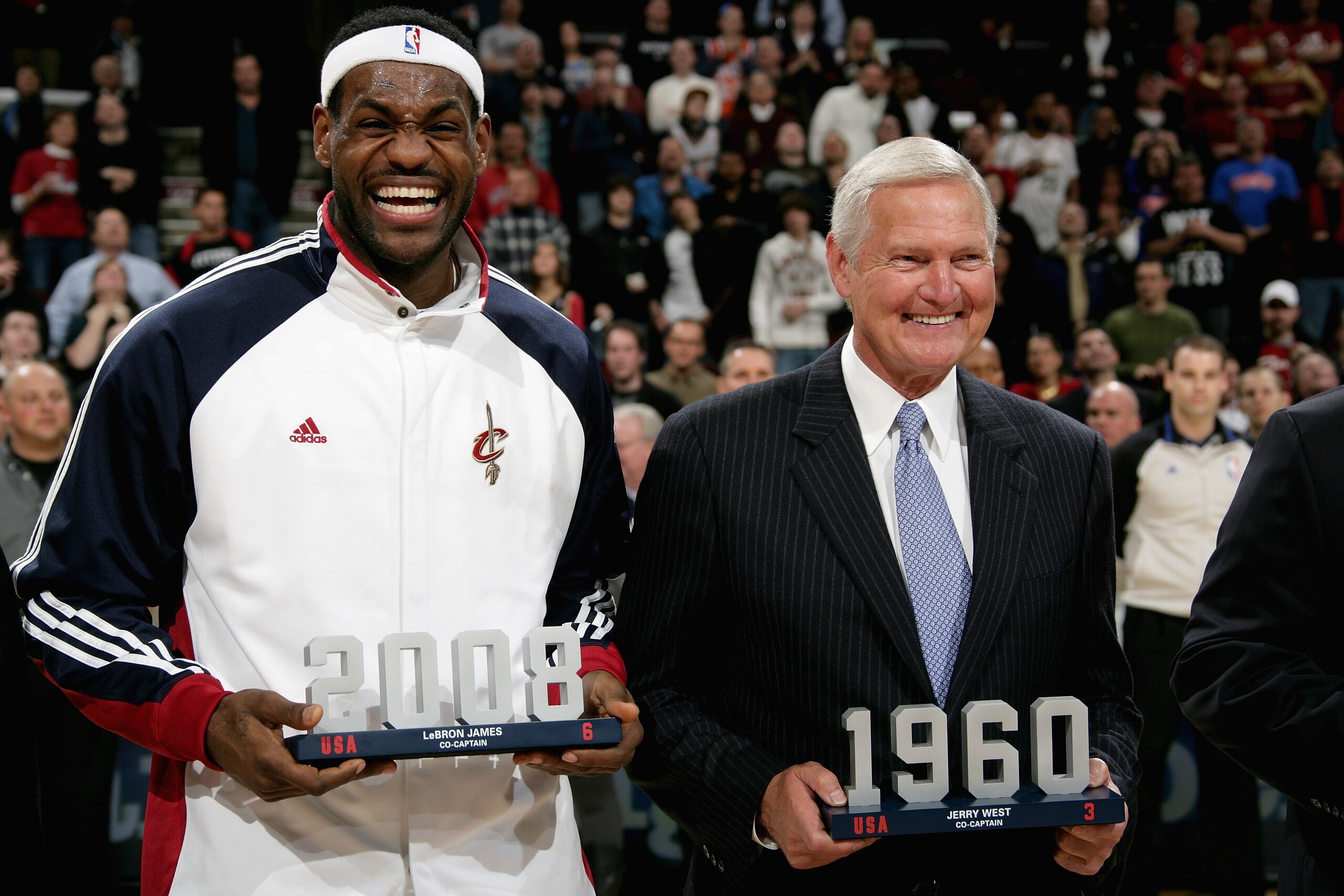 CLEVELAND - FEBRUARY 18: US Olympic basketball team captains LeBron James of the Cleveland Cavaliers and Jerry West receive a special award during the game between the Nuggets and the Cavaliers on February 18, 2010 at Quicken Loans Arena in Cleveland, Ohio. The Nuggets won in overtime 118-116. NOTE TO USER: User expressly acknowledges and agrees that, by downloading and/or using this Photograph, user is consenting to the terms and conditions of the Getty Images License Agreement. Mandatory Copyright Notice: Copyright 2010 NBAE (Photo by David Liam Kyle/NBAE via Getty Images) CLEVELAND - FEBRUARY 18: US Olympic basketball team captains LeBron James of the Cleveland Cavaliers and Jerry West receive a special award during the game between the Nuggets and the Cavaliers on February 18, 2010 at Quicken Loans Arena in Cleveland, Ohio. The Nuggets won in overtime 118-116. NOTE TO USER: User expressly acknowledges and agrees that, by downloading and/or using this Photograph, user is consenting to the terms and conditions of the Getty Images License Agreement. Mandatory Copyright Notice: Copyright 2010 NBAE (Photo by David Liam Kyle/NBAE via Getty Images)