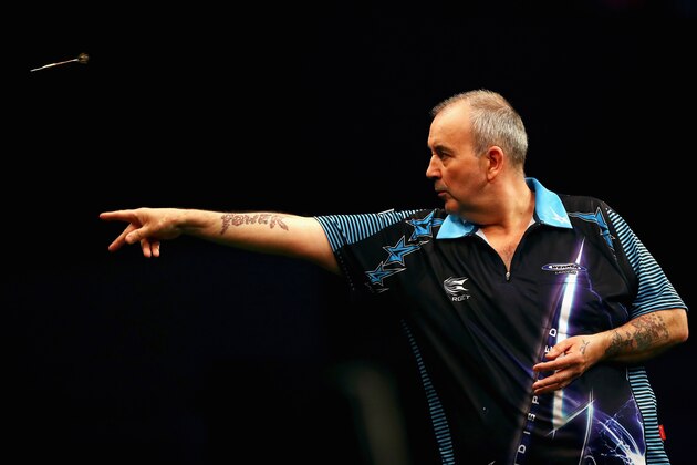 ROTTERDAM, NETHERLANDS - MAY 12:  Phil 'The Power' Taylor of England plays a shot in his match against Michael van Gerwen of the Netherlands during the Darts Betway Premier League Night 15 at Rotterdam Ahoy on May 12, 2016 in Rotterdam, .  (Photo by Dean Mouhtaropoulos/Getty Images)