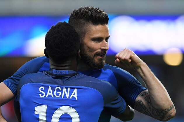France's forward Olivier Giroud (L) is congratuled by teammate Bacary Sagna after scoring a goal during the friendly football match between France and Scotland, at the St Symphorien Stadium in Metz, Eastern France, on June 4, 2016.  / AFP / FRANCK FIFE        (Photo credit should read FRANCK FIFE/AFP/Getty Images)