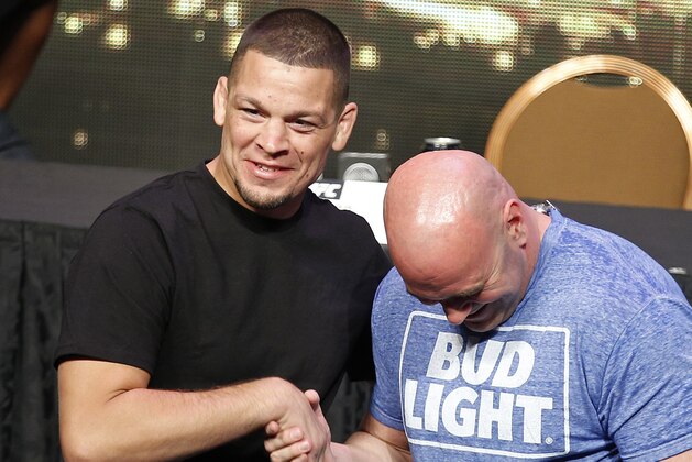 UFC president Dana White, right, and mixed martial arts fighter Nate Diaz attend a news conference for UFC 200, Friday, April 22, 2016, in Las Vegas. (AP Photo/John Locher)