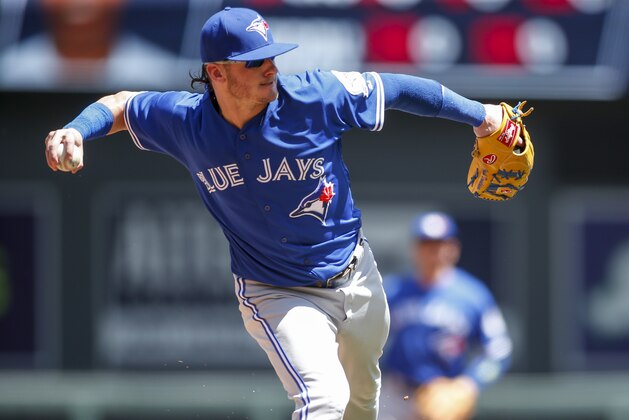 Toronto Blue Jays third baseman Josh Donaldson fields a ball hit by the Minnesota Twins in the first inning of a baseball game Sunday, May 22, 2016, in Minneapolis. The Blue Jays won 3-1. (AP Photo/Bruce Kluckhohn)