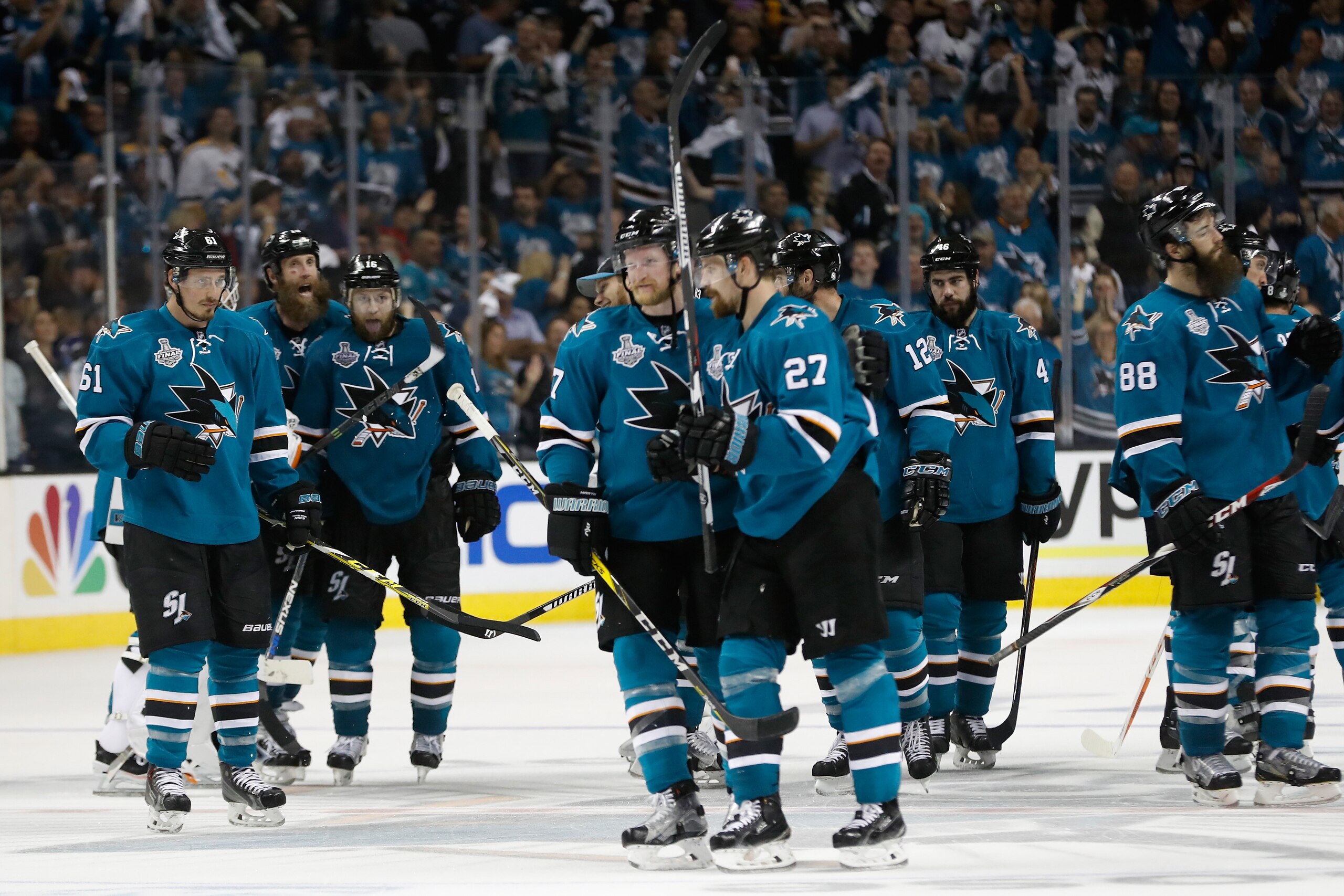 SAN JOSE, CA - JUNE 04:  Joonas Donskoi #27 of the San Jose Sharks celebrates with his teammates after scoring the game winning goal in overtime to defeat the Pittsburgh Penguins in Game Three of the 2016 NHL Stanley Cup Final with a score of 3 to 2 at SAP Center on June 4, 2016 in San Jose, California.  (Photo by Christian Petersen/Getty Images)