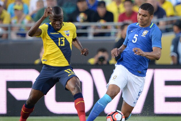 Ecuador's Enner Valencia (L) and Brazil's Casemiro vie for the ball during their Copa America Centenario football tournament match, at the Rose Bowl stadium in Pasadena, California, United States, on June 4, 2016.  / AFP / Robyn Beck        (Photo credit should read ROBYN BECK/AFP/Getty Images)