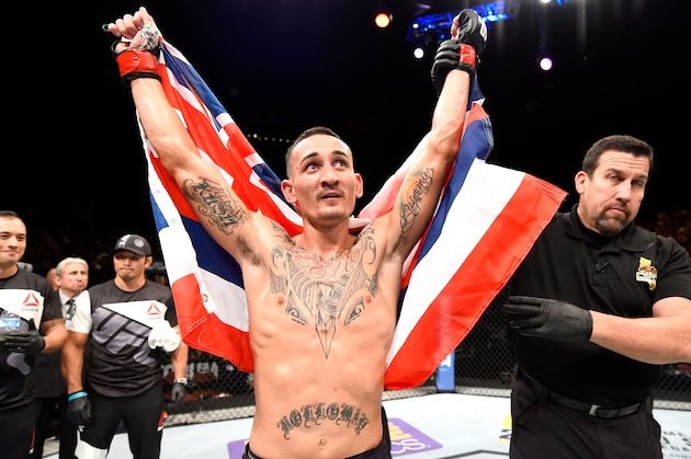 INGLEWOOD, CA - JUNE 04:  Max Holloway celebrates after defeating Ricardo Lamas by unanimous decision in their featherweight bout during the UFC 199 event at The Forum on June 4, 2016 in Inglewood, California.  (Photo by Josh Hedges/Zuffa LLC/Zuffa LLC via Getty Images)