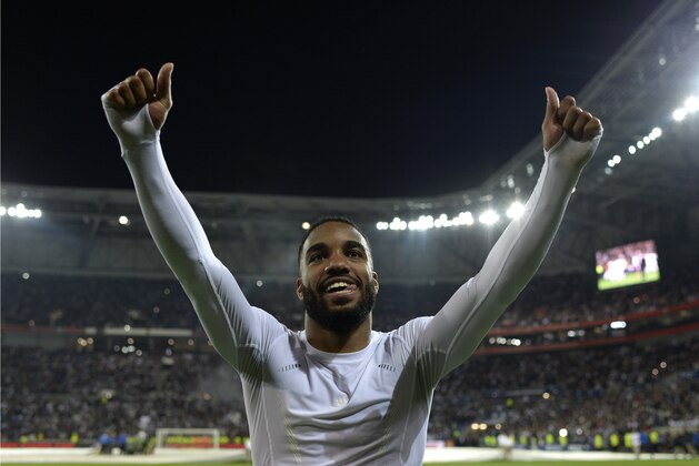 Lyon's French forward Alexandre Lacazette  (L) jubilates at the end of the French L1 football match between Lyon (OL) and Monaco (ASM) at the Parc de l'Olympique Lyonnais in Decines-Charpieu, central eastern France, on May 7, 2016. / AFP / ROMAIN LAFABREGUE        (Photo credit should read ROMAIN LAFABREGUE/AFP/Getty Images)