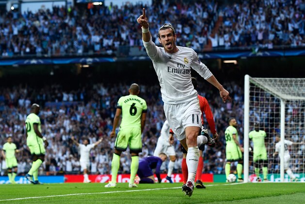 MADRID, SPAIN - MAY 04:  Gareth Bale of Real Madrid celebrates scoring the opening goal during the UEFA Champions League semi final, second leg match between Real Madrid and Manchester City FC at Estadio Santiago Bernabeu on May 4, 2016 in Madrid, Spain.  (Photo by David Ramos/Getty Images )