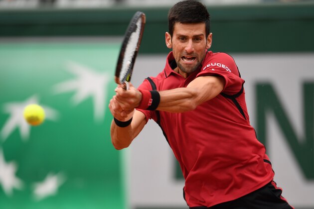 PARIS, FRANCE - JUNE 03:  Novak Djokovic of Serbia hits a backhand during the Men's Singles semi final match against Dominic Thiem of Austria on day thirteen of the 2016 French Open at Roland Garros on June 3, 2016 in Paris, France.  (Photo by Dennis Grombkowski/Getty Images)