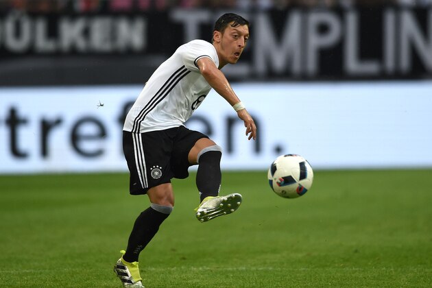 Germany's midfielder Mesut Oezil vies for the ball during the UEFA EURO 2016 friendly football match Germany vs Hungary at the Veltins Arena in Gelsenkirchen, western Germany on June 4, 2016. / AFP / PATRIK STOLLARZ        (Photo credit should read PATRIK STOLLARZ/AFP/Getty Images)
