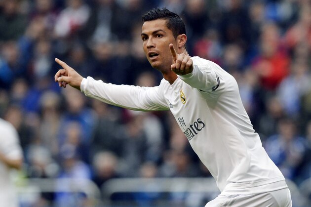 Real Madrid's Portuguese forward Cristiano Ronaldo celebrates after scoring a goal during the Spanish league football match RC Deportivo de la Coruna vs Real Madrid at the Riazor stadium in Coruna on May 14, 2016. / AFP / MIGUEL RIOPA        (Photo credit should read MIGUEL RIOPA/AFP/Getty Images)