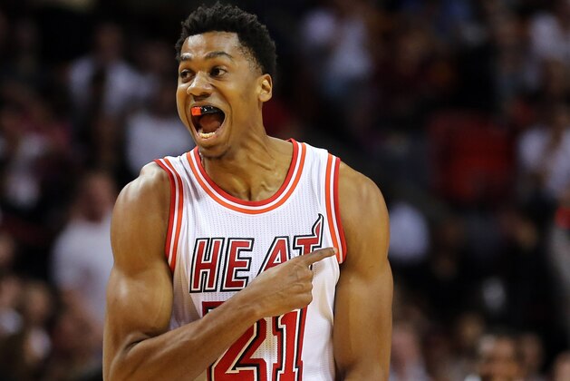 Feb 24, 2016; Miami, FL, USA; Miami Heat center Hassan Whiteside (21) reacts after he dunks the baseball against Golden State Warriors during the first half at American Airlines Arena. Mandatory Credit: Steve Mitchell-USA TODAY Sports