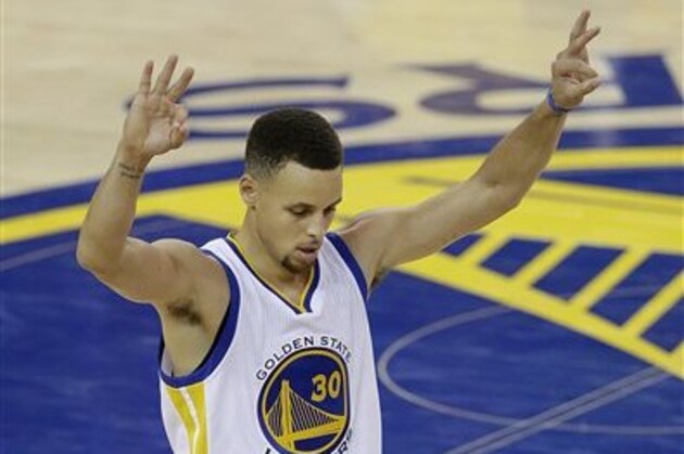 Golden State Warriors guard Stephen Curry (30) gestures after the Warriors scored against the Cleveland Cavaliers during the second half of Game 1 of basketball's NBA Finals in Oakland, Calif., Thursday, June 2, 2016. (AP Photo/Marcio Jose Sanchez)