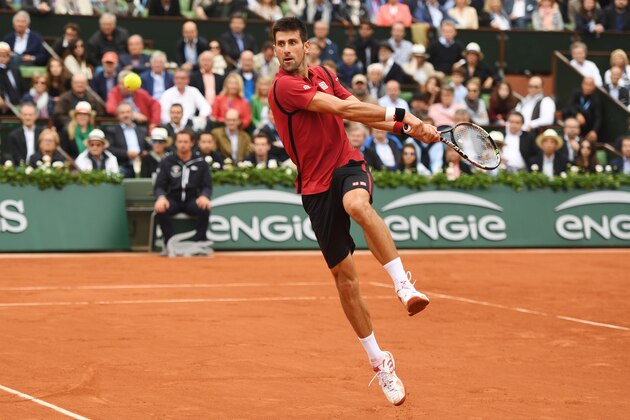 PARIS, FRANCE - JUNE 05:  Novak Djokovic of Serbia hits a backhand during the Men's Singles final match against Andy Murray of Great Britain on day fifteen of the 2016 French Open at Roland Garros on June 5, 2016 in Paris, France.  (Photo by Dennis Grombkowski/Getty Images)