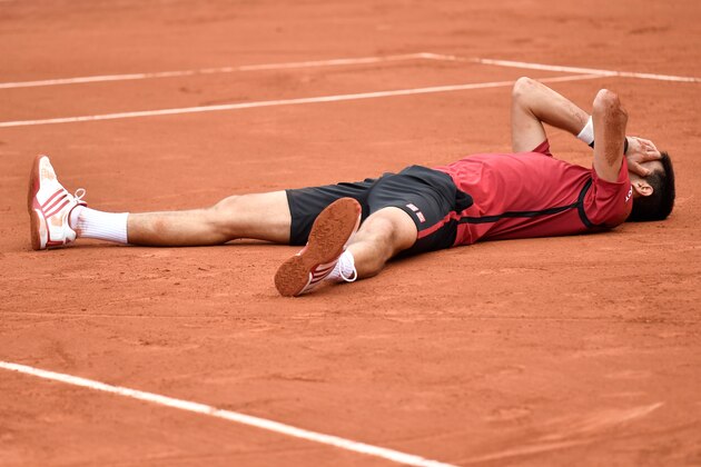 Serbia's Novak Djokovic celebrates after winning the men's final match against Britain's Andy Murray at the Roland Garros 2016 French Tennis Open in Paris on June 5, 2016. / AFP / PHILIPPE LOPEZ        (Photo credit should read PHILIPPE LOPEZ/AFP/Getty Images)