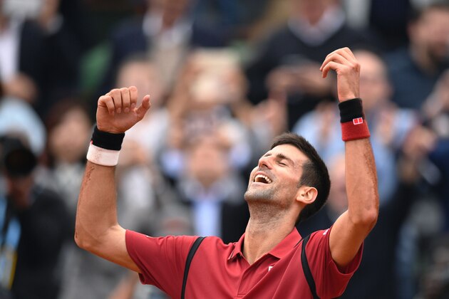 Serbia's Novak Djokovic reacts after winning the men's final match against Britain's Andy Murray at the Roland Garros 2016 French Tennis Open in Paris on June 5, 2016. / AFP / MARTIN BUREAU        (Photo credit should read MARTIN BUREAU/AFP/Getty Images)