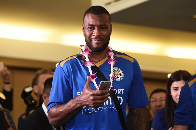 Wes Morgan smiles as Leicester City FC players arrive at Suvarnabhumi Airport in Bangkok on May 18, 2016. / AFP / LILLIAN SUWANRUMPHA        (Photo credit should read LILLIAN SUWANRUMPHA/AFP/Getty Images)