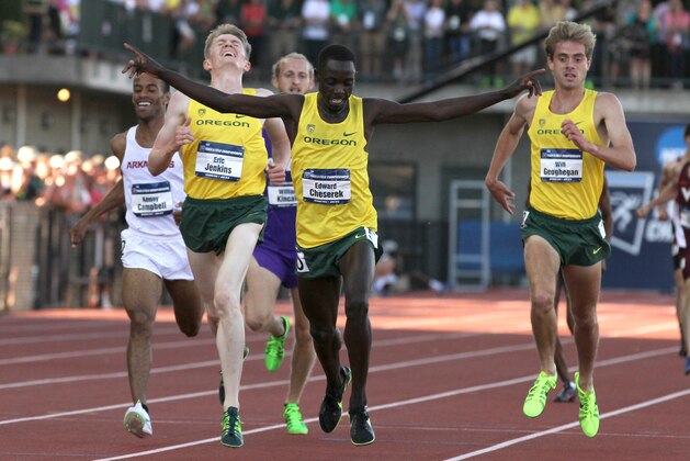 Oregon's Edward Cheserek crosses the finish line in the men's 5000 meter run during the NCAA track and field championships in Eugene, Ore., Friday, June 12, 2015. (AP Photo/Ryan Kang)