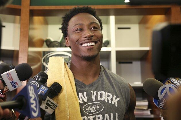 New York Jets wide receiver Brandon Marshall answers a question as he stands in the locker room after NFL football practice Wednesday, June 1, 2016, in Florham Park, N.J. (AP Photo/Mel Evans)