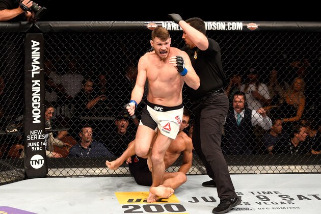 INGLEWOOD, CA - JUNE 04:  Michael Bisping of England celebrates after his first round knockout win against Luke Rockhold in their UFC middleweight championship bout during the UFC 199 event at The Forum on June 4, 2016 in Inglewood, California.  (Photo by Josh Hedges/Zuffa LLC/Zuffa LLC via Getty Images)