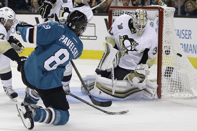 San Jose Sharks center Joe Pavelski (8) misses a shot against Pittsburgh Penguins goalie Matt Murray during overtime of Game 3 of the NHL hockey Stanley Cup Finals in San Jose, Calif., Saturday, June 4, 2016. (AP Photo/Marcio Jose Sanchez)