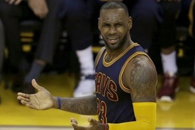 Cleveland Cavaliers forward LeBron James gestures during the first half of Game 2 of basketball's NBA Finals between the Golden State Warriors and the Cavaliers in Oakland, Calif., Sunday, June 5, 2016. (AP Photo/Ben Margot)