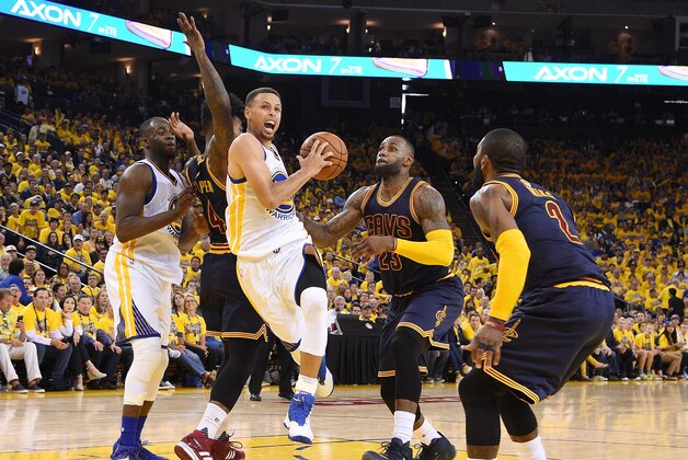 Jun 5, 2016; Oakland, CA, USA; Golden State Warriors guard Stephen Curry (30) drives to the basket against Cleveland Cavaliers forward LeBron James (23) during the third quarter in game two of the NBA Finals at Oracle Arena. Mandatory Credit: Kyle Terada-USA TODAY Sports