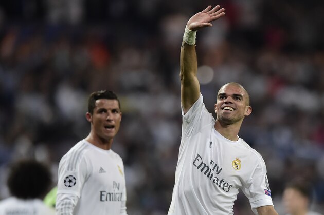 Real Madrid's Portuguese defender Pepe (R) and Real Madrid's Portuguese forward Cristiano Ronaldo celebrate at the end the UEFA Champions League semi-final second leg football match Real Madrid CF vs Manchester City FC at the Santiago Bernabeu stadium in Madrid on May 4, 2016. / AFP / JAVIER SORIANO        (Photo credit should read JAVIER SORIANO/AFP/Getty Images)
