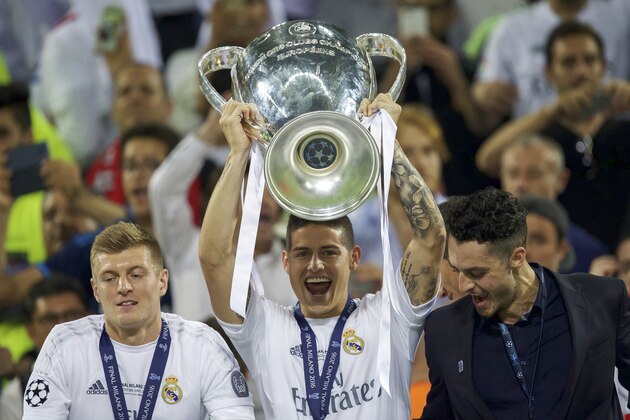 (L-R) Toni Kroos of Real Madrid, James Rodriguez of Real Madrid with Champions League trophy, Coupe des clubs Champions Europeeens during the UEFA Champions League final match between Real Madrid and Atletico Madrid on May 28, 2016 at the Giuseppe Meazza San Siro stadium in Milan, Italy.(Photo by VI Images via Getty Images)