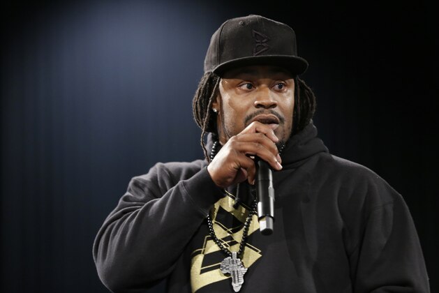 Marshawn Lynch, a former NFL football running back with the Seattle Seahawks, speaks Thursday, May 5, 2016, at a job fair in Seattle sponsored by the 100,000 Opportunities Initiative, an organization backed by Starbucks and other companies that seeks to increase employment and education opportunities for youth aged 16-24. The Seahawks announced Thursday that Lynch has been placed on the reserve/retired list. (AP Photo/Ted S. Warren)
