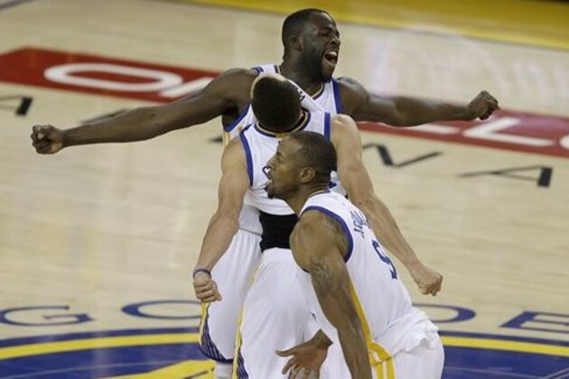 FILE - In this Monday, May 30, 2016, file photo, Golden State Warriors forward Draymond Green, from top, Stephen Curry and Andre Iguodala celebrate after beating the Oklahoma City Thunder in Game 7 of the NBA basketball Western Conference finals in Oakland, Calif. All season long, MVP Stephen Curry, Klay Thompson and Draymond Green have drawn the most attention and accolades.  When it comes to the biggest moments of the playoffs, that’s when the Warriors turn to Iguodala, and last year’s NBA Finals MVP is a major reason why the defending champions are back in this spot with a chance to repeat.  (AP Photo/Ben Margot, File)