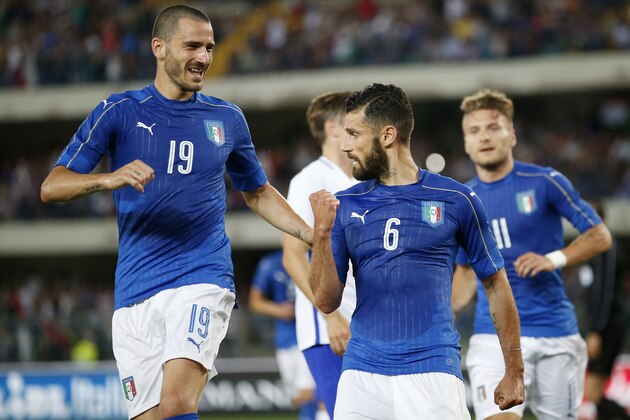 Italy's Antonio Candreva, right, celebrates with his teammate Leonardo Bonucci after scoring during the international friendly soccer match between Italy and Finland, at the Bentegodi stadium in Verona, Italy, Monday, June 6, 2016. (AP Photo/Antonio Calanni)