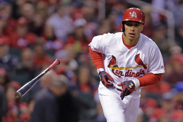 St. Louis Cardinals' Kolten Wong tosses his bat after drawing a walk during the third inning of a baseball game against the Colorado Rockies, Tuesday, May 17, 2016, in St. Louis. (AP Photo/Tom Gannam)